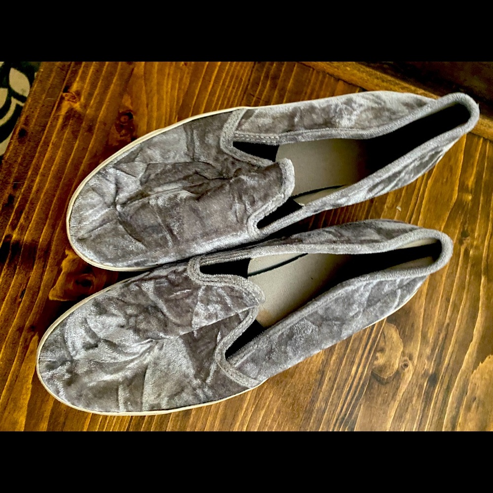 Grey soft shoes. Look like Vans.